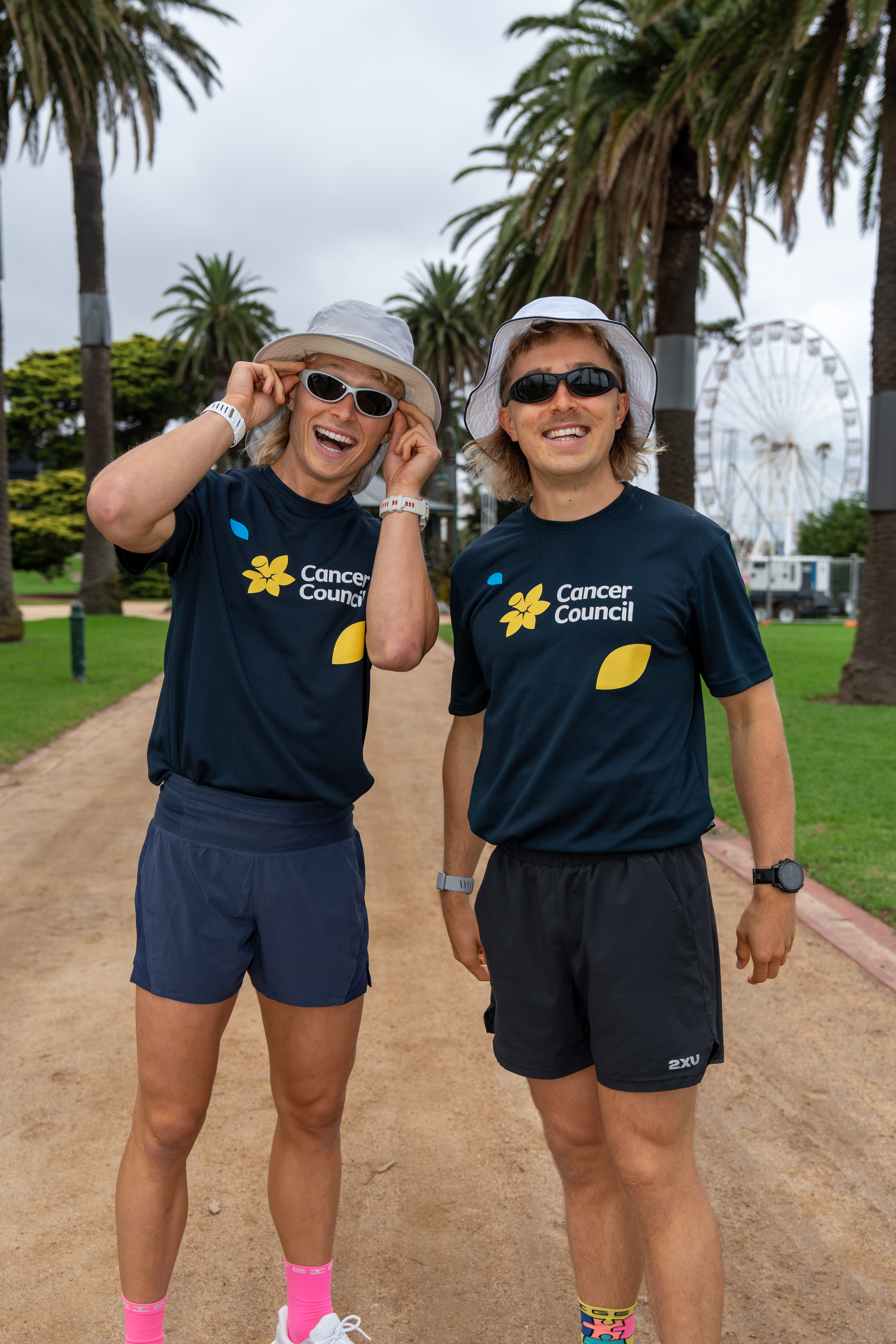 Image: The Lambros, Stefan and Lachie wearing Cancer Council tshirts, hats and sunnies 